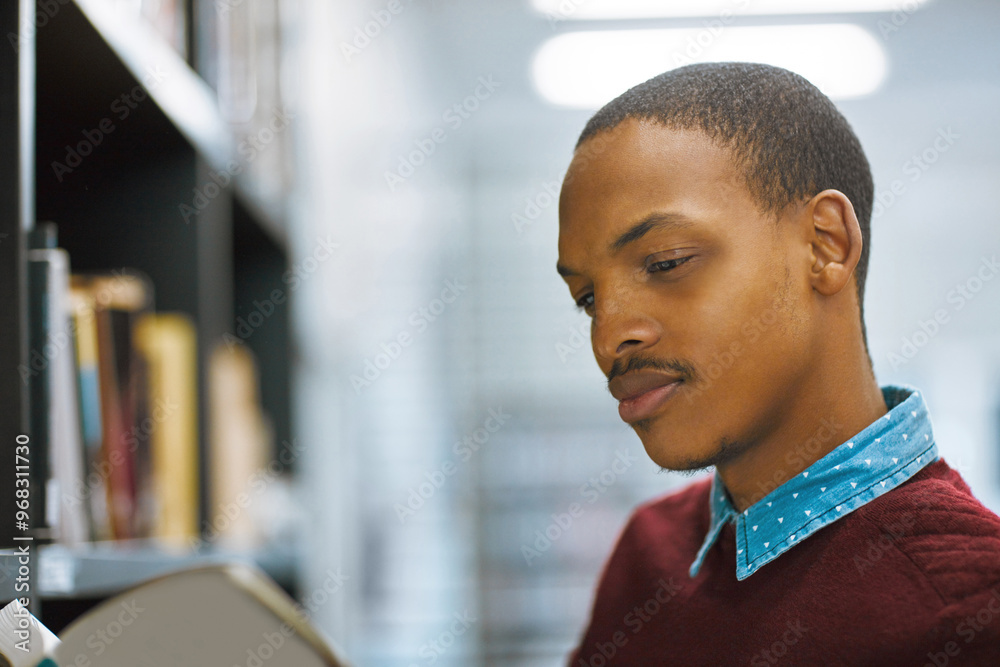 Poster student, book and research with man in library for scholarship, knowledge and learning. education, u