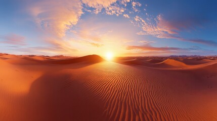 Obraz premium A panoramic view of the desert at sunrise, with the first light illuminating the sand dunes.