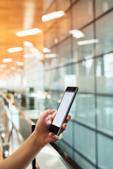 Hand, person and phone screen at airport in waiting room for travel schedule, flight information and booking ticket. Mobile, online and kiosk registration for passport, transport website and vacation