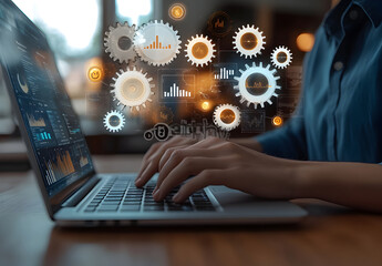 Businessman working on a laptop with digital gears and graphs