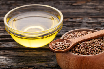 Flaxseed oil in bowl - Healthy Linum usitatissimum seeds.