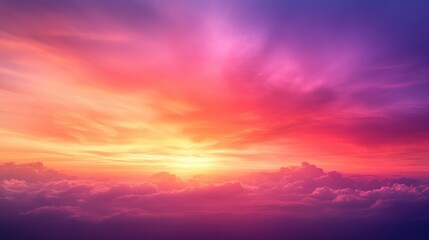 A vibrant sunset paints the sky with hues of orange, pink, and purple, creating a stunning view over fluffy clouds.