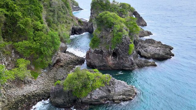 Aerial Footage: Seawater Splashes on Rocky Shoreline