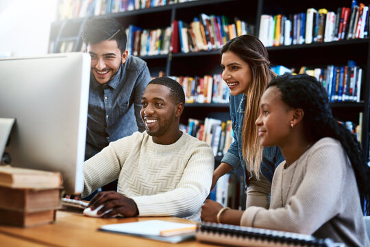 Students, computer and study in library for college, learning and education with exam collaboration. People, friends and diversity on university campus for research project, scholarship and IT course