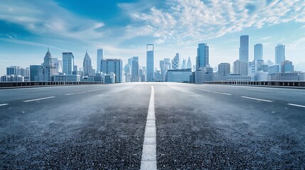 Fototapeta premium A empty road with a city in the background