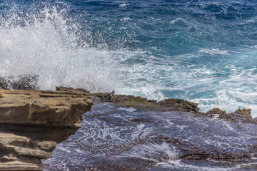 Dramatic Ocean crashing wave Hawaii at Makapu Point