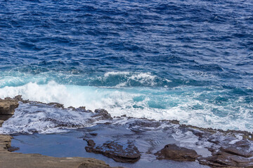 Dramatic Ocean crashing wave Hawaii at Makapu Point