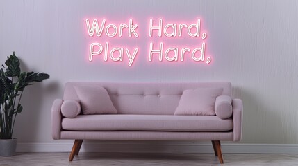 Pink neon sign with the phrase "Work Hard, Play Hard" hanging above a pink couch in a modern living room.