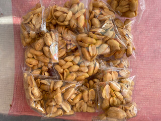 Fried peanuts packaged in plastic are commonly found in food stalls in Indonesia