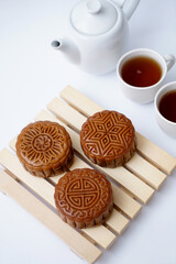 Delicious Cantonese moon cake for Mid-Autumn Festival food mooncake on wooden table background