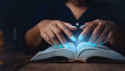 hands with glowing eyes in the dark from a magic book