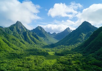 Obraz premium Lush green mountains and valleys under a blue sky