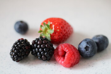 Mixed berries collection. Fresh Strawberry, blueberry, raspberry, blackberry. Healthy diet with vitamins. Mix fruits colorful food. For grocery, recipe ingredients, skincare breakfast for weight loss.