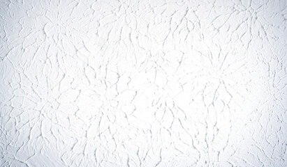 White textured wall or ceiling with plaster painted. Flat light texture with circular pattern and artistic impression.