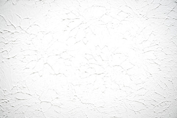 White textured wall or ceiling with plaster painted. Flat light texture with circular pattern and artistic impression.