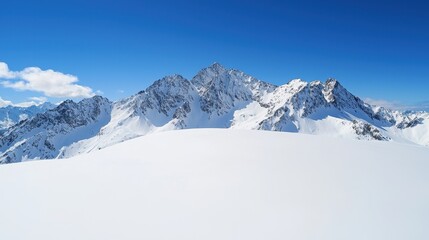Fototapeta premium Majestic Snowy Mountain Peaks Under a Clear Blue Sky