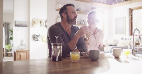 Couple, man or woman and eating breakfast in kitchen for conversation, happy and wellness in home with sunlight. People, meal or feeding on weekend for peace, relax and bonding with love or care - Powered by Adobe