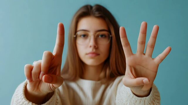 Young Woman Showing Numbers with Fingers