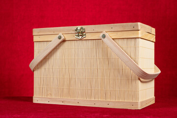 a bamboo container on red backgrond