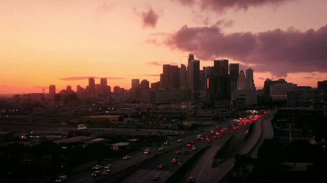 Aerial of Downtown Los Angeles Skyline Sunset over Highway 101 During Rush Hour 2
