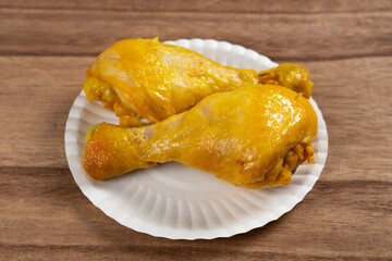 angle view two large salt-baked chicken drumsticks at horizontal composition