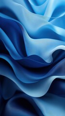 Obraz premium A stunning close-up of flowing blue fabric, showcasing elegant waves and soft textures, ideal for abstract and artistic themes.