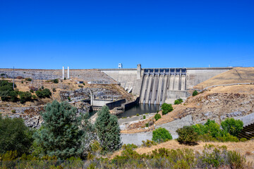 Folsom Dam with trees in foreground
