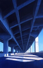 A stunning view of a concrete bridge showcasing strong architectural lines under a clear blue sky. Perfect for transportation themes.