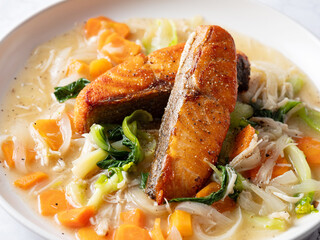 Salmon steak with vegetables on a plate