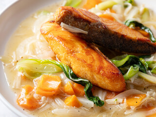 Salmon steak with vegetables on a plate