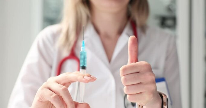 Doctor prepares a vaccination at a clinic, emphasizing importance of immunization for public health