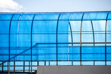 A blue roof with a blue tarp covering it