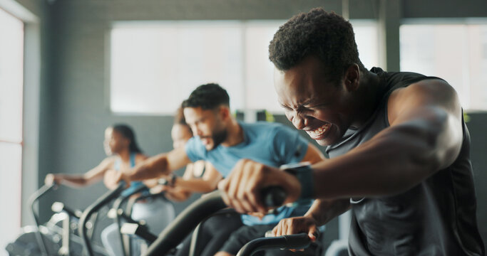 Exercise bike, fitness and training with people in gym together for cardio or intense workout. Active, elliptical machine and power with athlete group in health club for challenge or performance - Powered by Adobe