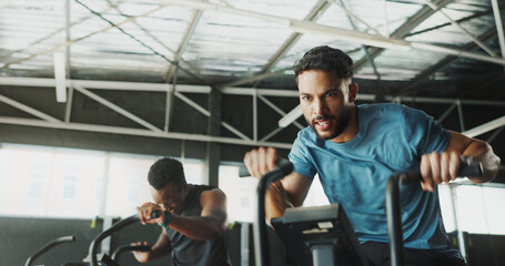 Cardio, exercise bike and mission with man in gym for intense training or physical workout....