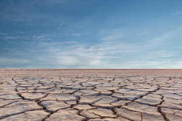 Fototapeta premium Landscape of soil drought cracked with sunset.