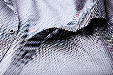 Close up of dark Men's shirt. Soft focus. Copy space.	