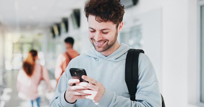 Campus, results or happy man with phone in college for learning application or education. Social media text, university or proud student on mobile for academic registration or scholarship test marks