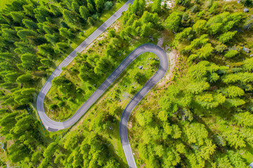 Snake Road in the Dolomites. Sunrise aerial forest