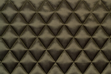 Quilted fabric. The texture of the blanket. 