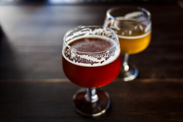 Craft beer tasting at a cozy bar with different beer styles in the evening