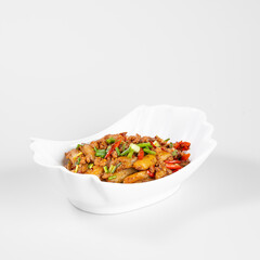 A delicious dish of stir-fried vegetables and sausages served in a white ceramic bowl against a plain background.