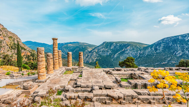 Delphi with ruins of the Temple of the ancient Sanctuary of Apollo in Delphi, Greece, at the Mount Parnassus
