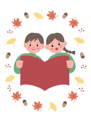 本を広げる子供と秋のモチーフ