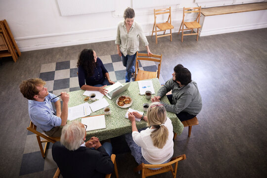 Business team discussing strategy at desk in office during meeting