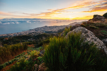 beautiful sunset over the city of Funchal on Madeira from the location Miradouro do Pico Alto....