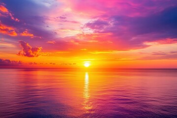 Obraz premium Golden Hour Sunset Over the Ocean: Stunning Reflection of Colors in Tranquil Waters