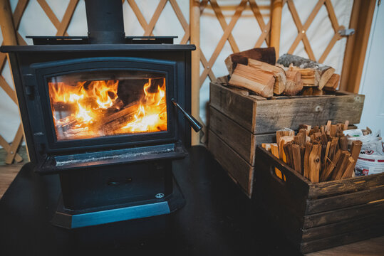 High angle view of wood by fireplace in yurt
