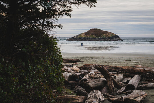 Scenic view of island in sea against cloudy sky