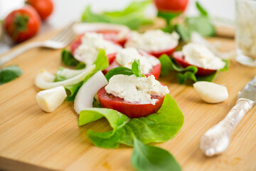 tomato wedges with cottage cheese filling and garlic, spicy appetizer