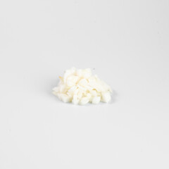 Close-up of a pile of small, white objects against a plain background, perfect for themes related to minimalism or simplicity.